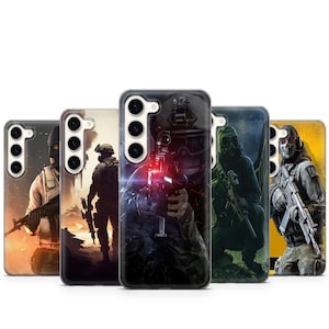 May include: A collection of five phone cases featuring military-themed artwork. Each case displays a different soldier illustration, with varying color schemes and action poses. The cases are designed to fit a specific phone model.