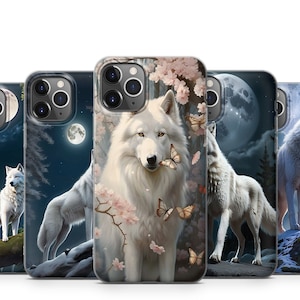 May include: Set of four phone cases featuring white wolves in different settings. One case has a wolf in a forest with a full moon, another has a wolf in a snowy landscape, another has a wolf in a forest with pink flowers, and the last has a wolf in a forest with a full moon and butterflies.