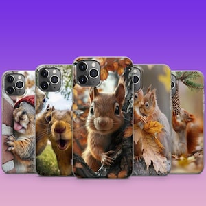 May include: Five different phone cases featuring various images of squirrels. The cases are all clear and show the phone's camera lenses. The images include a squirrel peeking out from behind a tree, a squirrel looking directly at the camera, a squirrel with a red hat, a squirrel with a red hat, and a squirrel with a red hat.