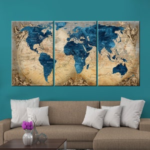 May include: A three-piece canvas print set featuring a vintage world map with blue oceans and continents in beige and brown tones. The map is surrounded by a decorative border with ornate details.