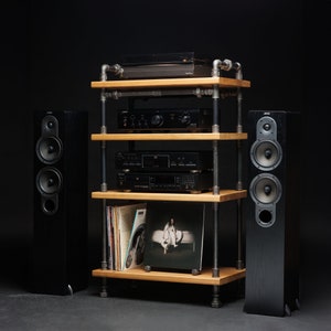 May include: A black wooden stereo system with a turntable, amplifier, CD player, and two speakers on a black metal shelf unit with wooden shelves.