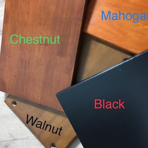 May include: Four wood samples in different colors: chestnut, walnut, mahogany, and black.
