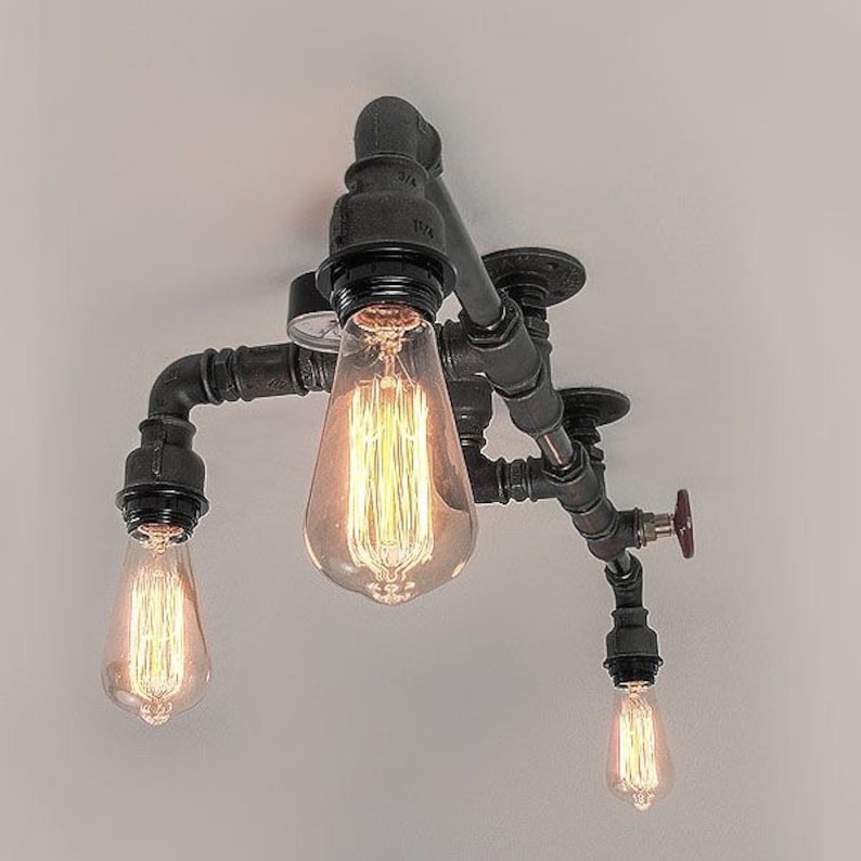 May include: A black metal pipe light fixture with four Edison bulbs. The fixture has a red valve and a gauge.