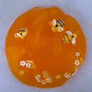 Raw Honey Jelly Slime, scented like honey, honey slime with bee charm and honeycomb fimo slices, thick jelly slime, honey gift, coated slime