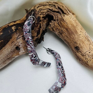Stunning fordite earrings.