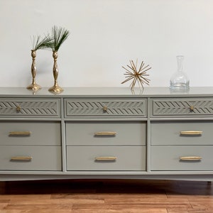 SOLD         MCM mid century dresser with grey lacquer and polished brass hardware