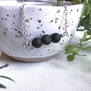 Unwaxed Black Lava Bead Necklace. Essential oil diffuser necklace. Minimalist lava stone 3 bead stainless steel necklace.