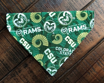 May include: Green and yellow dog bandana with the Colorado State Rams logo and the words "Colorado State Rams" and "CSU" repeated throughout.
