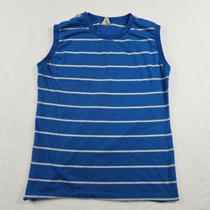 May include: A sleeveless crew neck shirt featuring a vibrant blue base color with thin, horizontal white stripes running across the entire garment. The shirt has a solid blue ribbed collar and matching blue trim around the arm openings.