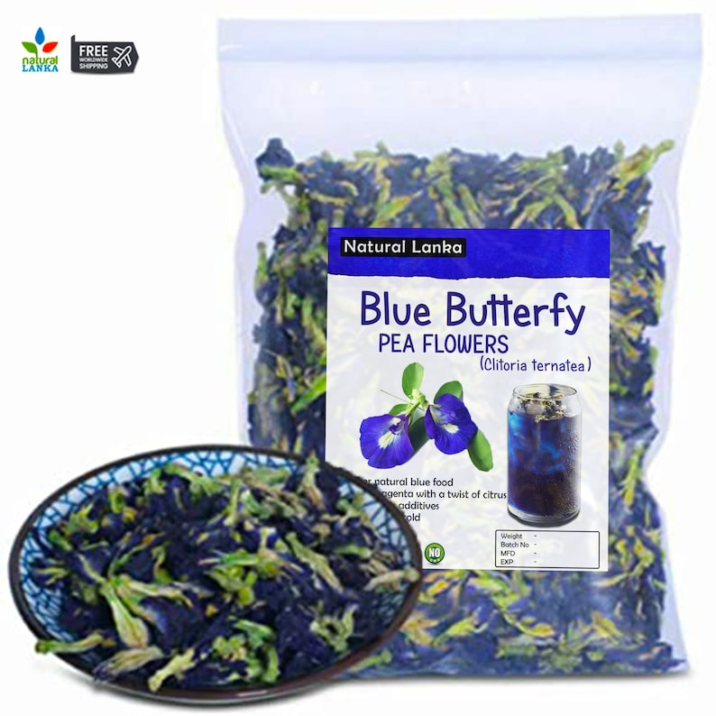 May include: A clear plastic bag filled with dried blue butterfly pea flowers. The bag has a label that reads "Natural Lanka Blue Butterfly Pea Flowers (Clitoria ternatea)". A small bowl of the flowers is in the foreground.
