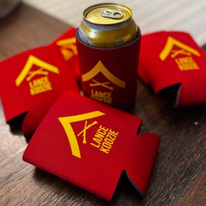 May include: A white ceramic mug with a black handle and the text "But First, Coffee" in a black, bold font. The mug is on a white surface.