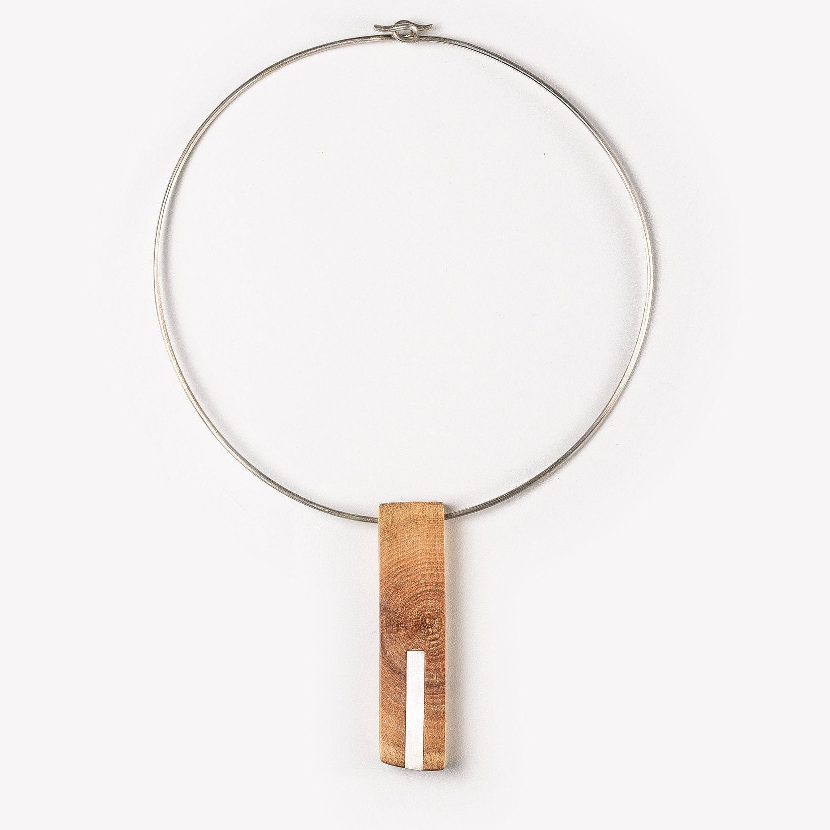 Handmade modern necklace made of silver and wood. Unique geometrical design.