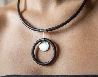 Handmade modern necklace made of silver and caoutchouc. Unique geometrical design.