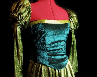 May include: A green velvet dress with a fitted bodice and a full skirt. The dress has long sleeves with puffed shoulders and a green ribbon trim at the neckline.