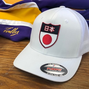 White FlexFit Hat with a Japan Embroidered Twill Crest
