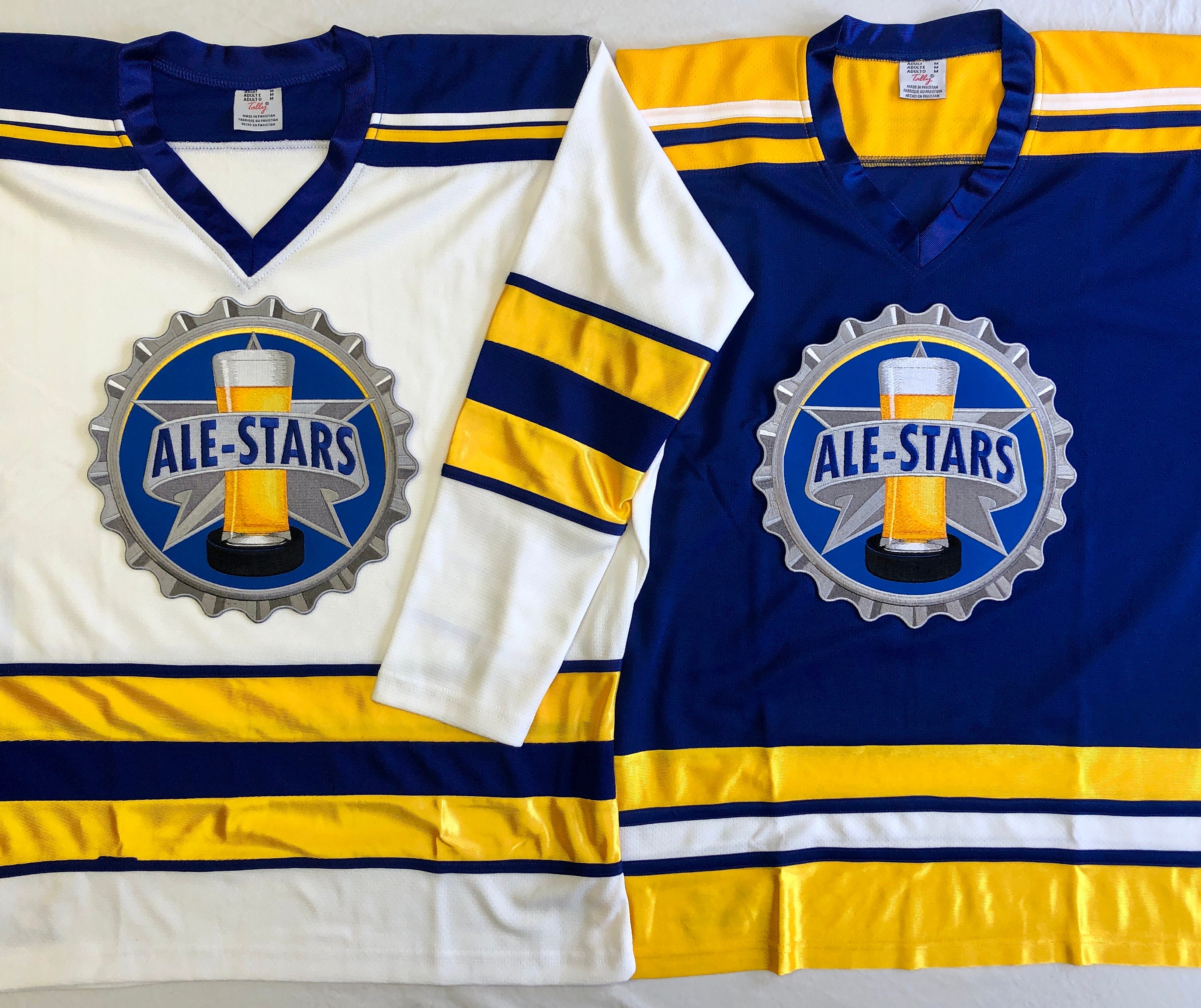 Custom Hockey Jerseys - Solid Body Alternating Waist and Sleeve Stripes - Team Name, Player Name and Numbers on Sleeves - Team Designation
