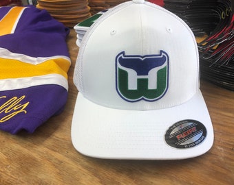 White Flexfit Hat With a Blackhawk Hawk 