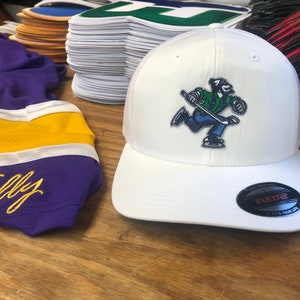 White FlexFit Hat with a Johnny Canuck Embroidered Twill Crest