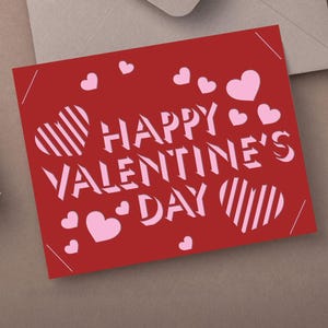 May include: A red Valentine's Day card with the words "HAPPY VALENTINE'S DAY" in white, along with pink hearts. The card has a simple, modern design, perfect for expressing love and affection.