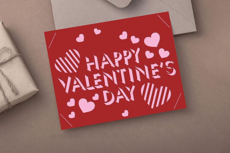 May include: A red Valentine's Day card with the words "HAPPY VALENTINE'S DAY" in white, along with pink hearts. The card has a simple, modern design, perfect for expressing love and affection.