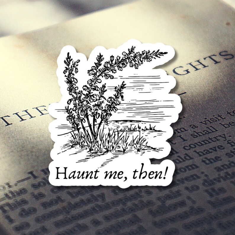 Puede incluir: Una pegatina blanca con una ilustraci&oacute;n en blanco y negro de una planta y un paisaje. La pegatina tiene el texto "Haunt me, then!" en una fuente negra estilizada. La pegatina est&aacute; colocada encima de un libro abierto.