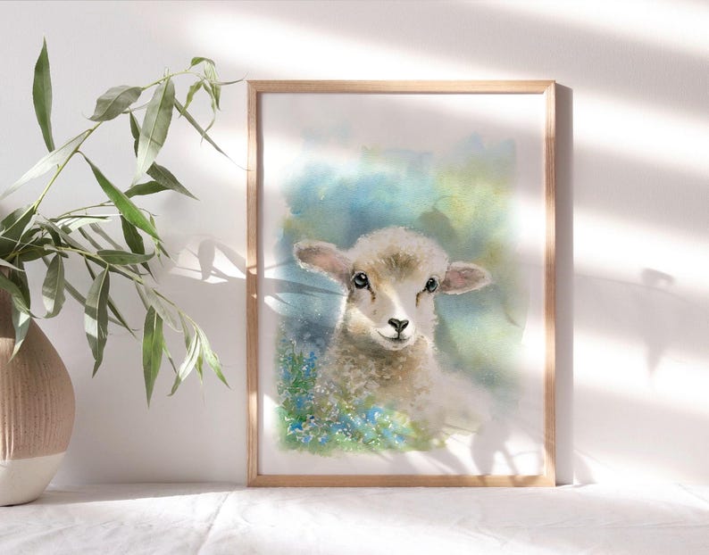 May include: A watercolor painting of a white lamb with blue and green flowers in the background. The lamb is looking directly at the viewer with its head tilted slightly to the side.
