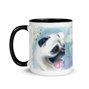 May include: White ceramic mug with a black rim and handle. The mug features a watercolor painting of a pug with a blue and green background.