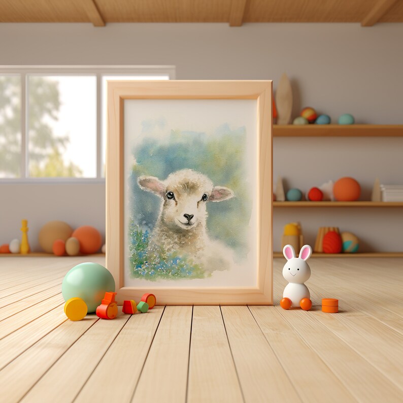 May include: A watercolor painting of a white lamb with a light blue background. The lamb is looking at the viewer with its head tilted slightly to the side. The painting is framed in a light wood frame.