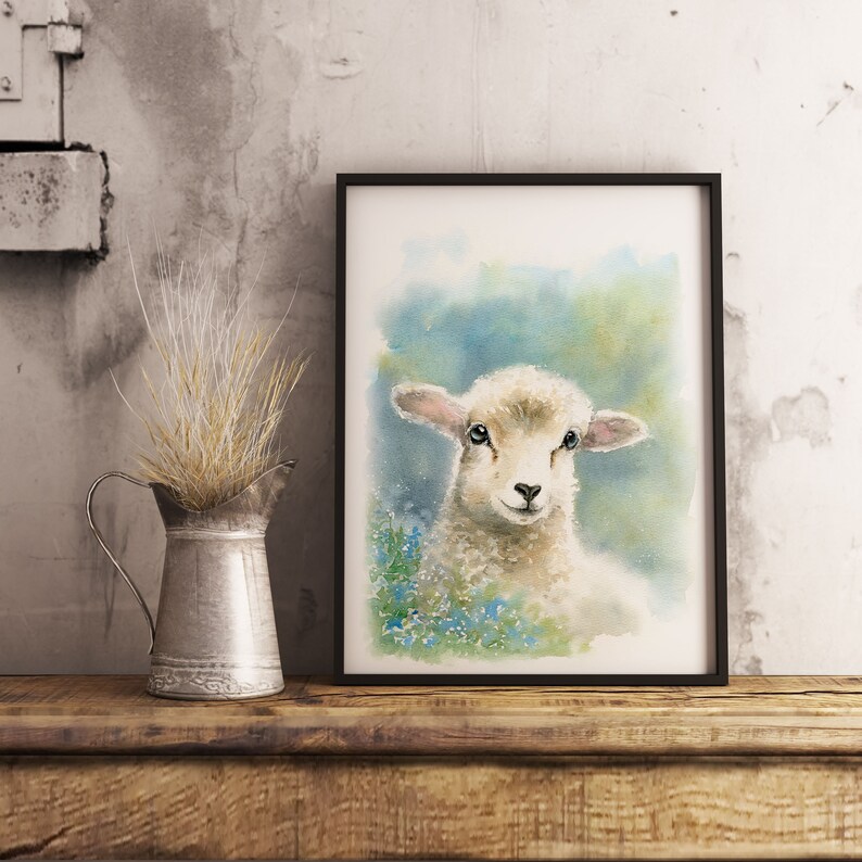 May include: Watercolor painting of a white lamb with blue flowers in the background. The lamb is looking directly at the viewer with a sweet expression.