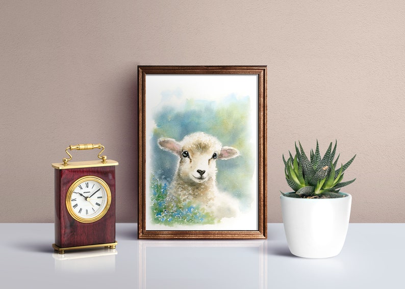 May include: A watercolor painting of a white lamb with black eyes and a light blue background. The lamb is surrounded by blue flowers.