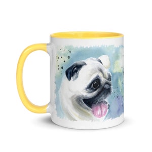 May include: A white ceramic mug with a yellow rim features a watercolor painting of a pug dog with a light blue, green, and purple background.