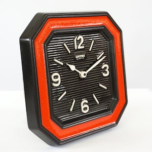 Vintage red and black glazed ceramic wall clock from Lectra, West Germany. 1960s. Mid century modern.