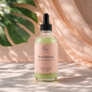 May include: A clear glass bottle filled with light green liquid, topped with a black dropper cap. The label is light pink with black text reading Root Revival, Follicle Boosting Scalp Serum, and 4 fl. oz / 118ml, featuring a small circular logo.