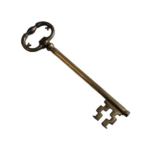 May include: A vintage-style key with a brass finish. The key features an ornate handle with a looped design and a long, straight shaft. The key's bit has a decorative, cross-shaped pattern. The key is likely used for decorative purposes.