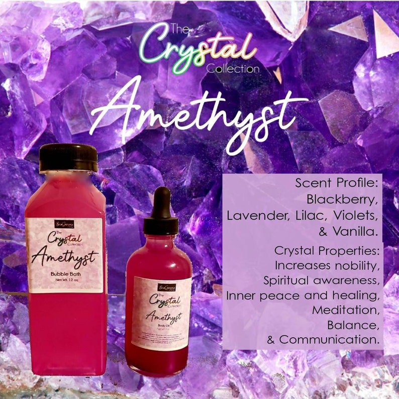 May include: Two bottles of amethyst-themed bath and body products. The larger bottle is a bubble bath, and the smaller bottle is a body oil. Both bottles are purple and have a label that says "The Crystal Collection Amethyst". The text on the label also includes the scent profile and crystal properties.
