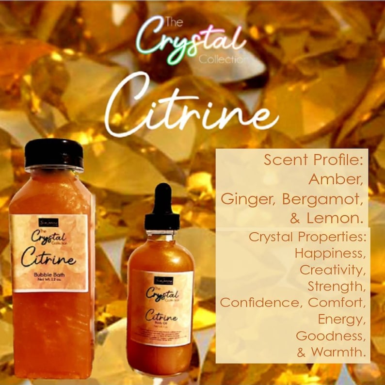 May include: Two amber glass bottles with gold labels. The labels read "The Crystal Collection Citrine" and feature a crystal image. The larger bottle is a bubble bath and the smaller bottle is a body oil. The text on the right side of the image reads "Scent Profile: Amber, Ginger, Bergamot, & Lemon. Crystal Properties: Happiness, Creativity, Strength, Confidence, Comfort, Energy, Goodness, & Warmth."