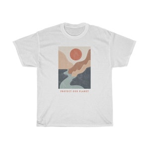 May include: White t-shirt with a graphic of a mountain range with a red sun and a blue river. The text "PROTECT OUR PLANET" is printed below the graphic.