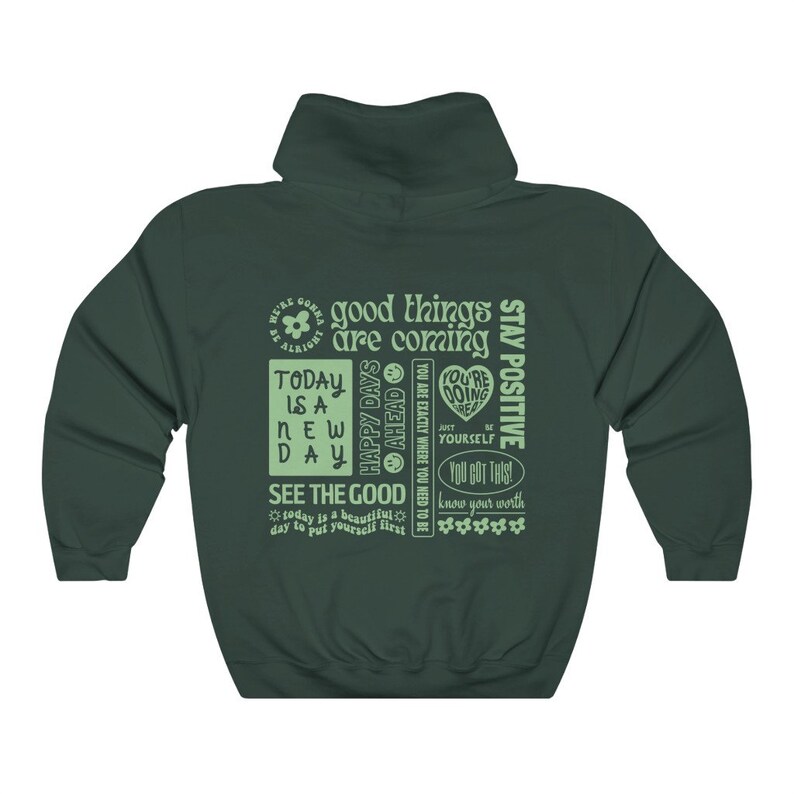May include: Green hooded sweatshirt with a light green print of motivational phrases and a flower graphic. The text includes "good things are coming", "today is a new day", "happy days ahead", "see the good", "stay positive", "you got this", and "know your worth".