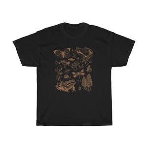 May include: Black t-shirt with a brown graphic print of various forest creatures, including butterflies, frogs, mushrooms, and dragonflies.