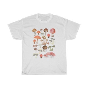 May include: White t-shirt with a colorful mushroom print. The mushrooms are in various shades of red, orange, brown, and white.