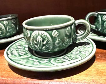 May include: A set of three ceramic mugs with a speckled, matte finish in cream, light grey, and dark grey. Each mug has a simple, modern design and a comfortable handle. Ideal for tea or coffee.
