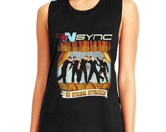 May include: Black sleeveless shirt featuring a graphic of the band *NSYNC on a stage. The band's logo is at the top, with the words "NO STRINGS ATTACHED" below the band members.
