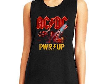 May include: Black sleeveless shirt featuring the band AC/DC's logo in red and a stage performance graphic. The text "PWR UP" is printed in yellow with a lightning bolt.