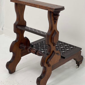 Free Shipping Within Continental US Antique table with metal accent and casters. image 2