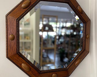 Free shipping within continental US - Antique Arts and Crafts Octagonal Beveled Mirror with Carved Oak Frame and Decorative Wood Peg Inlays