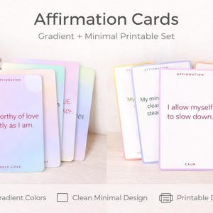 May include: A set of affirmation cards with soft gradient colors and a clean, minimal design. Each card features a unique affirmation statement in a simple font. The cards are designed for self-love and calm.