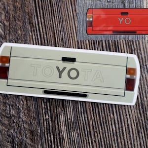 Rood-witte of lichtbruine achterklepsticker Toyota Pick-up YO minivrachtwagen