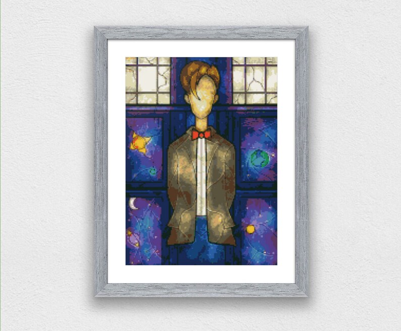 May include: A framed illustration of a person standing in front of a stained glass window. The window has a blue, purple, and gold design. The person is wearing a brown jacket and a red bow tie. The background is a dark blue with stars.