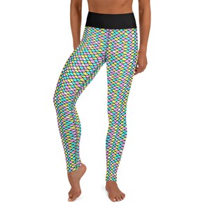 May include: A pair of black high-waisted leggings with a colorful mermaid scale pattern in pink, blue, and yellow.