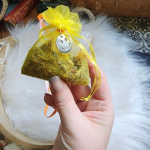 Happiness Mojo Gris Gris Bag. Made by Audra of Lifespiritssocietyofmagick.com with real hoodoo spells & magick. Full of herbs and crystals.